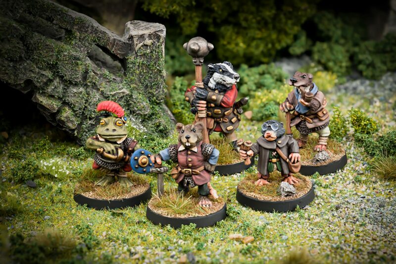 Guardians of the riverbank Ratty Toad Badger Mole and Otter 28mm fanstasy miniatures in high quality white metal from Northumbrian Tin Soldier beside the bridge standing on Grass