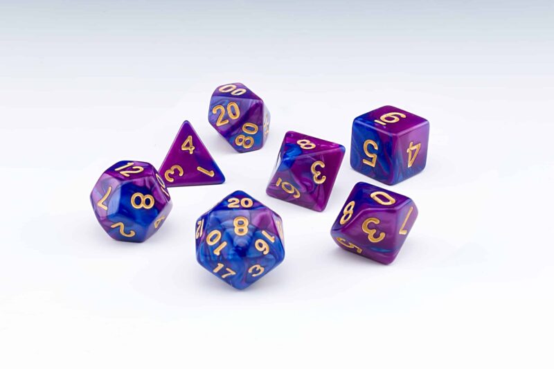 Regis purple and blue blended colour set of 7 RPG dice with Gold numbers from Northumbrian Tin Soldier on a white background
